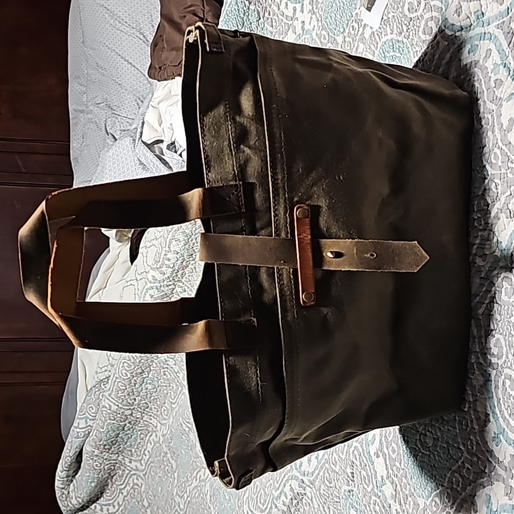 Canvas bag with leather straps and handles. Never used